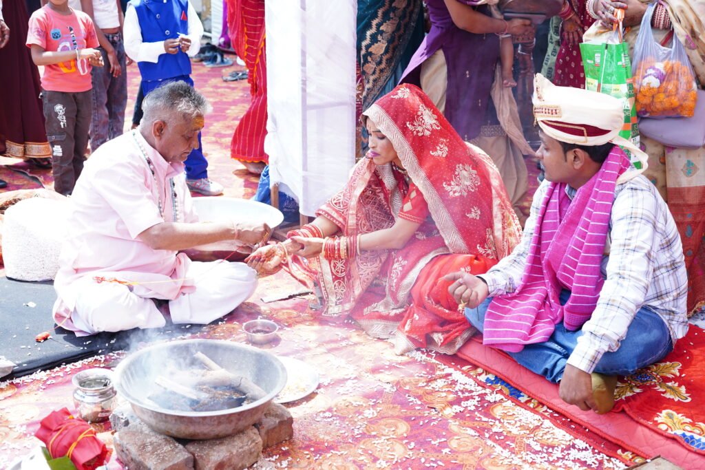 Bride and groom performing traditional Indian wedding rituals through Matrimonial Today trusted marriage bureau